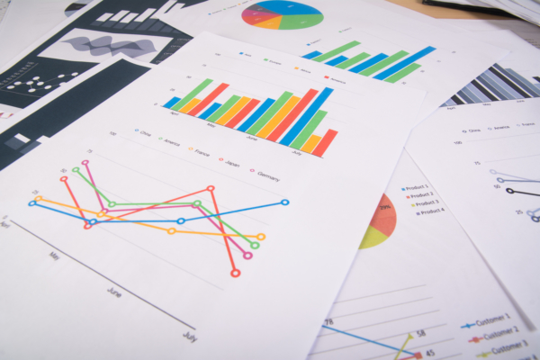 Business report. Graphs and charts. Business reports and pile of